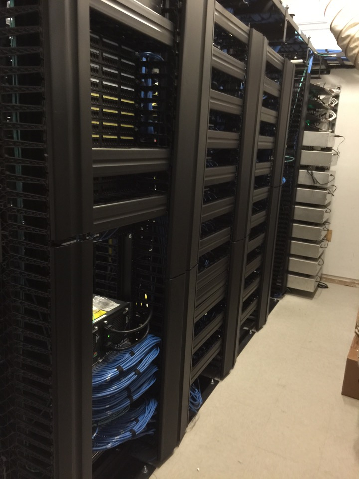 Network equipment racks and cabling from Wajid Mirza’s legacy work gallery.